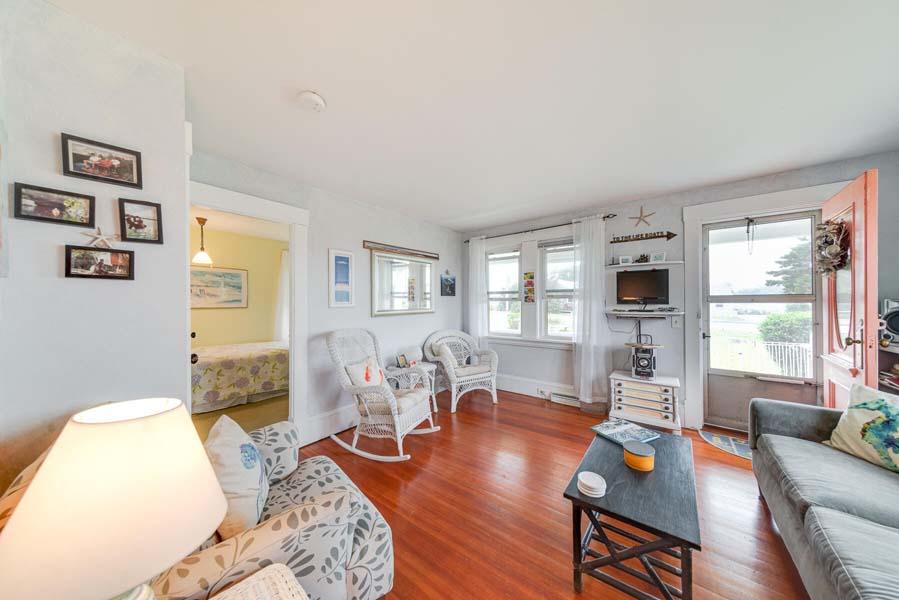 139 Shore Road Truro, MA 02666 - Photo 18 of 30 a living room with furniture and a wooden floor