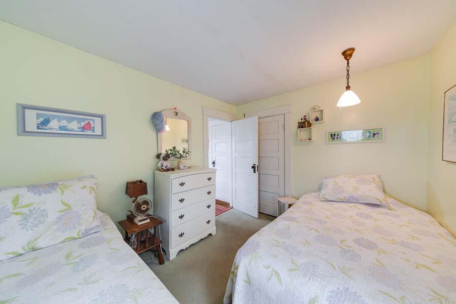 139 Shore Road Truro, MA 02666 - Photo 27 of 30 a bedroom with a bed and a dresser