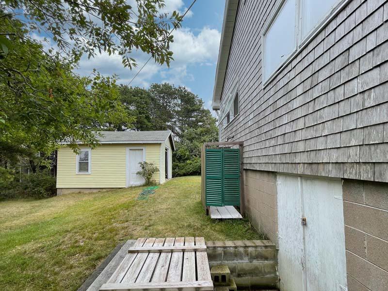 139 Shore Road Truro, MA 02666 - Photo 9 of 30 a view of a house with a yard