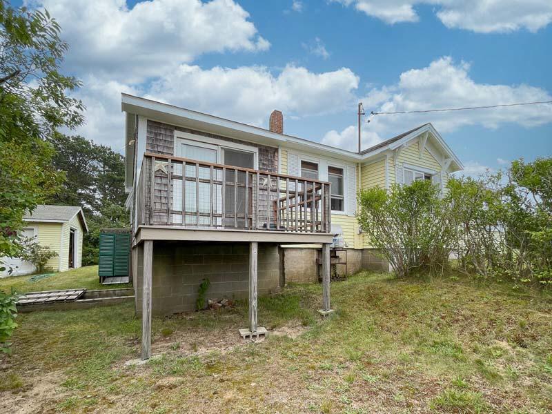 139 Shore Road Truro, MA 02666 - Photo 10 of 30 a view of a house with a yard