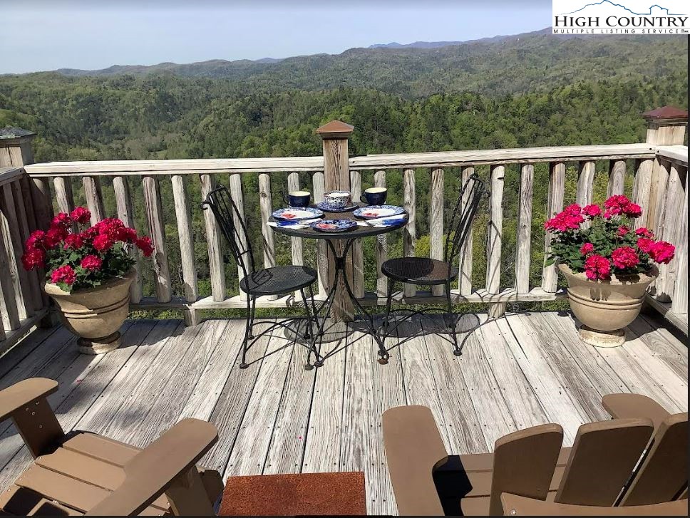 208 Granny's Ridge Road Ferguson, NC 28624 - Photo 29 of 37 a view of balcony with furniture and flowers