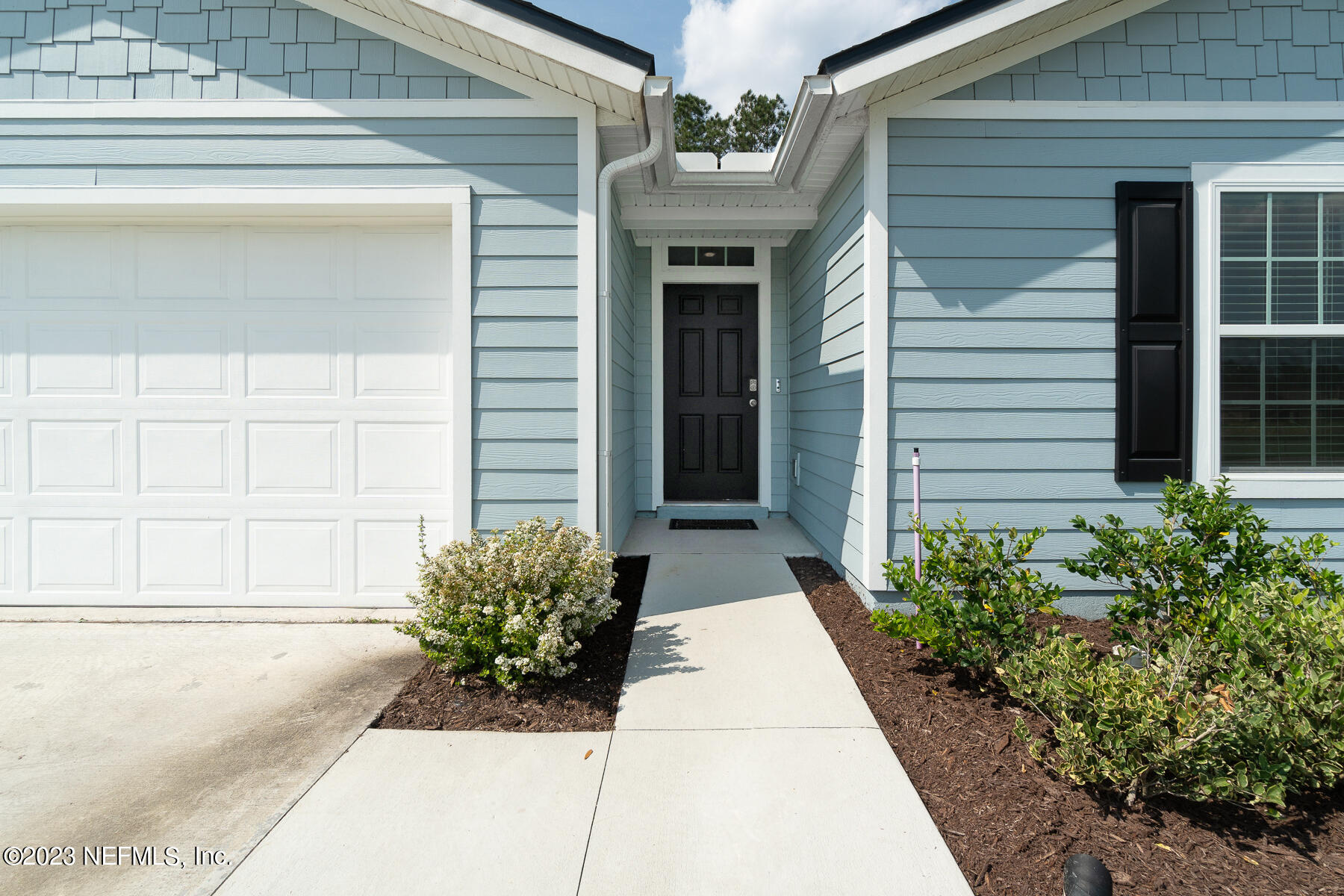 79 Rivertown Road Palm Coast, FL 32137 - Photo 5 of 29 Ext Front Walkway