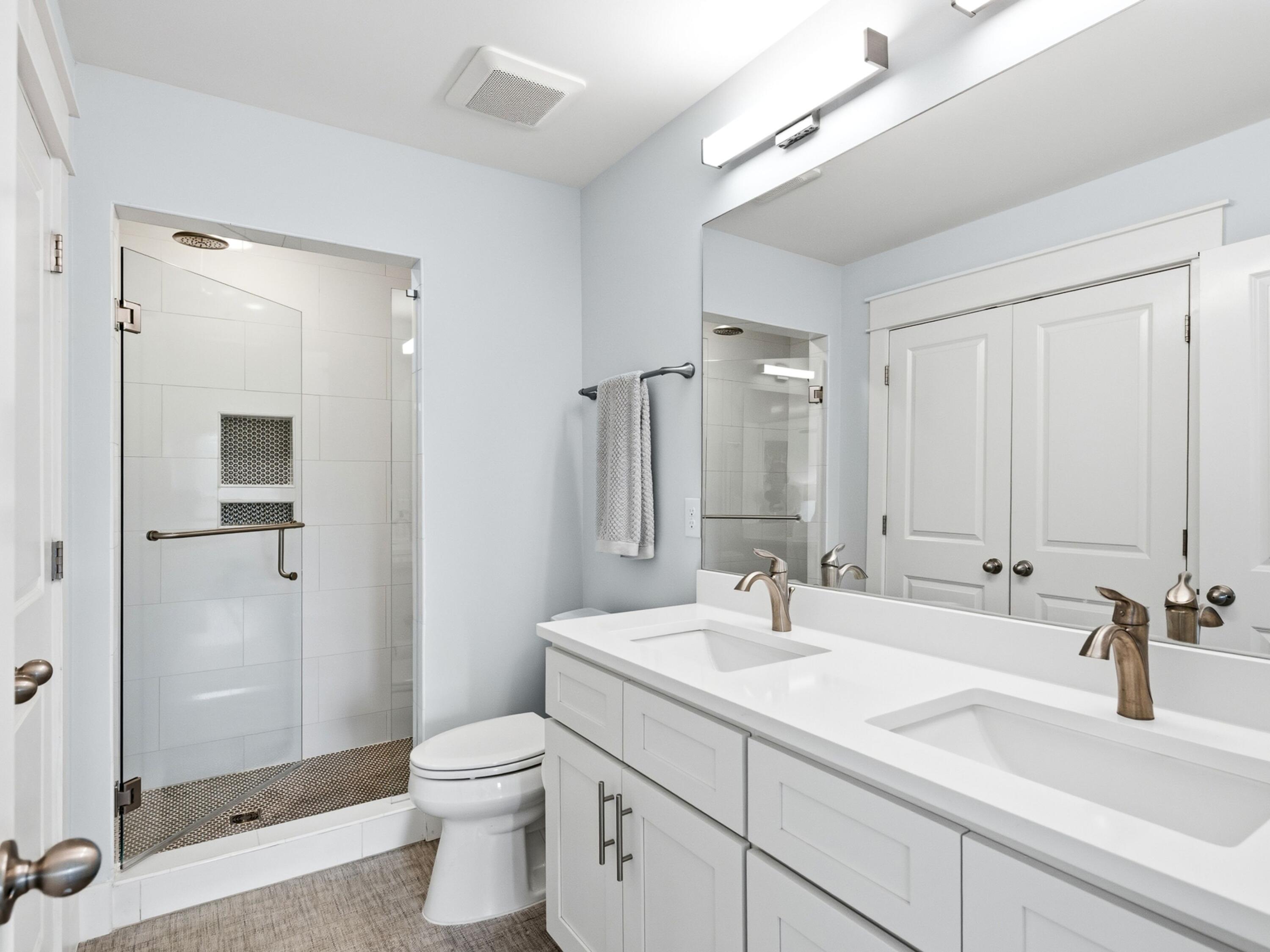 59 Conscience Way Santa Rosa Beach, FL 32459 - Photo 21 of 41 a bathroom with a double vanity sink toilet and shower