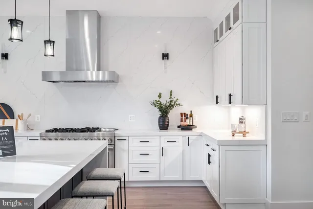 a kitchen with cabinets and window