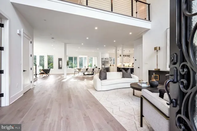 a view of a living room kitchen and a wooden floor