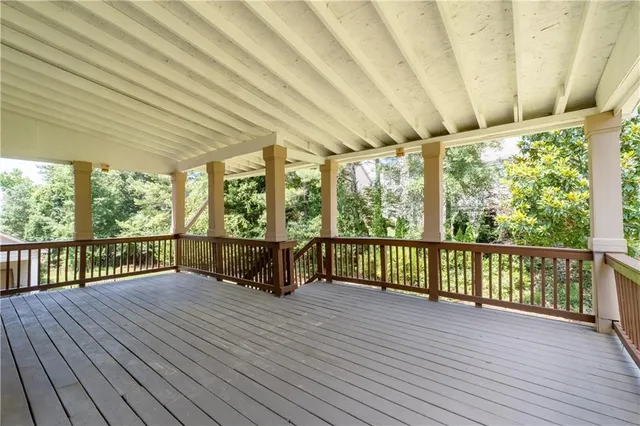 a view of porch with wooden floor