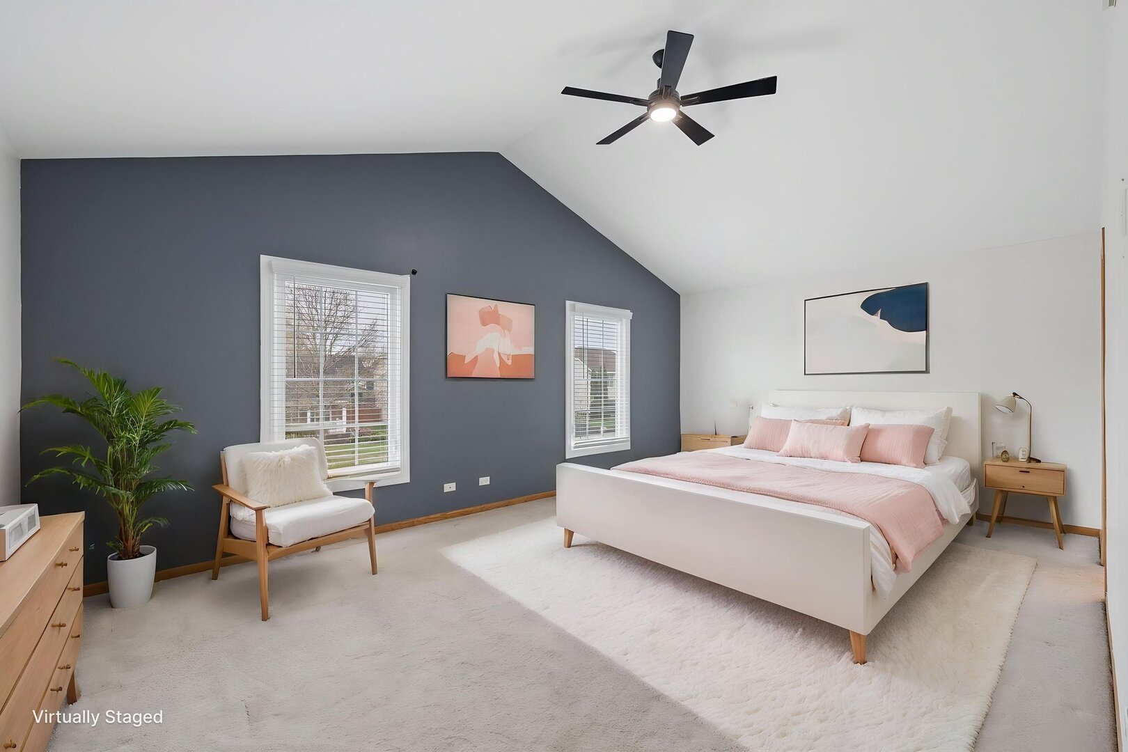 740 Countryside Drive Bolingbrook, IL 60490 - Photo 14 of 29 a bedroom with a bed a couch and a potted plant