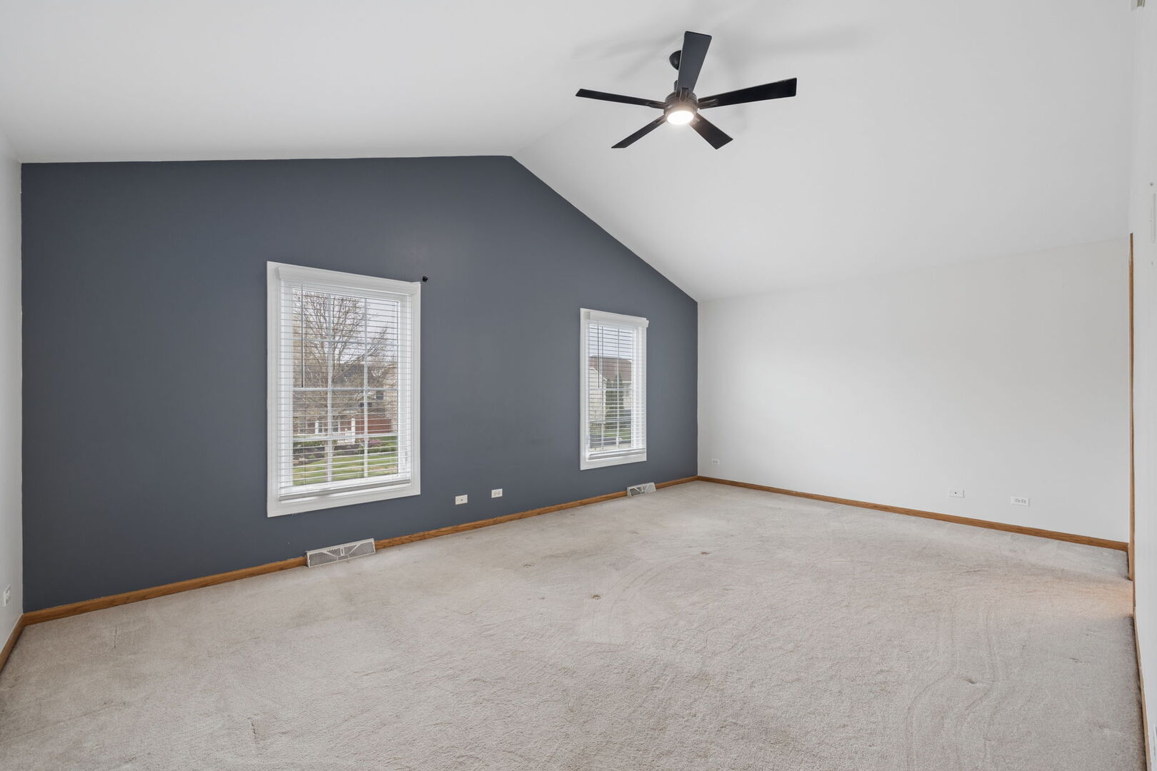 740 Countryside Drive Bolingbrook, IL 60490 - Photo 15 of 29 an empty room with windows and fan
