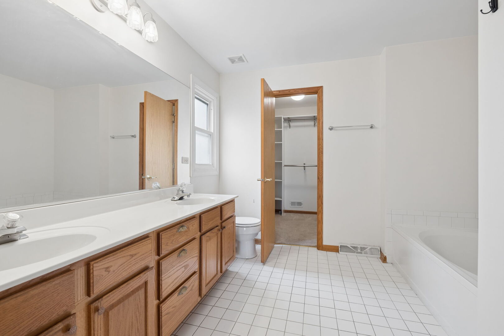740 Countryside Drive Bolingbrook, IL 60490 - Photo 16 of 29 a bathroom with a sink a toilet and shower