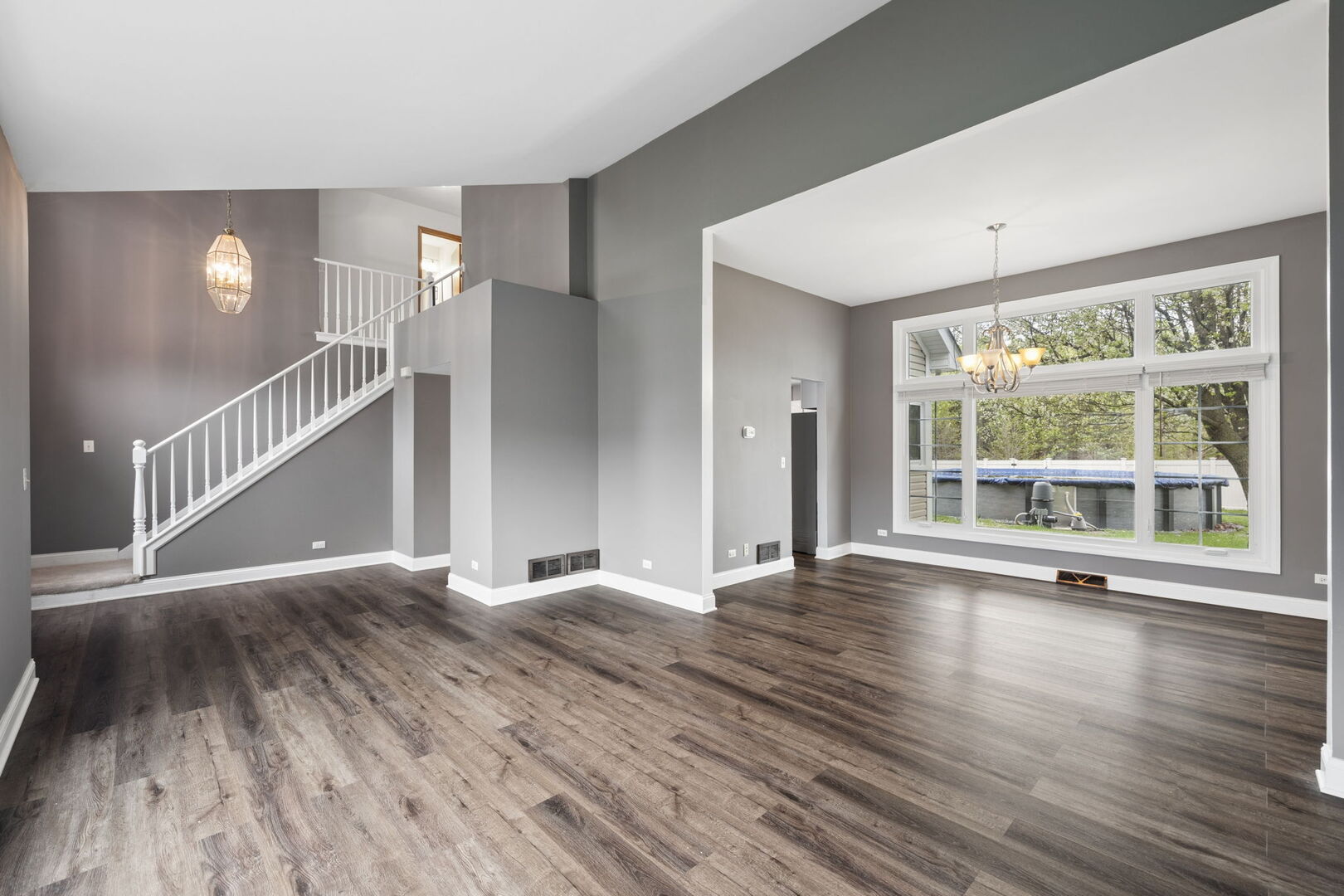 740 Countryside Drive Bolingbrook, IL 60490 - Photo 6 of 29 a view of an empty room with wooden floor and a window