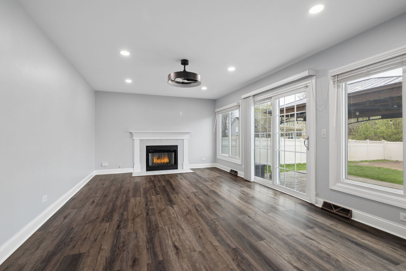 740 Countryside Drive Bolingbrook, IL 60490 - Photo 10 of 29 a view of an empty room with a fireplace and window