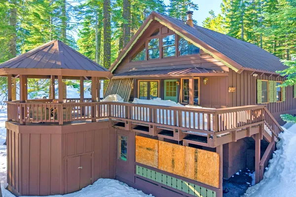 a view of front door of house with deck