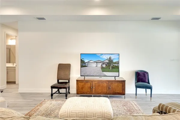 a living room with furniture and a rug