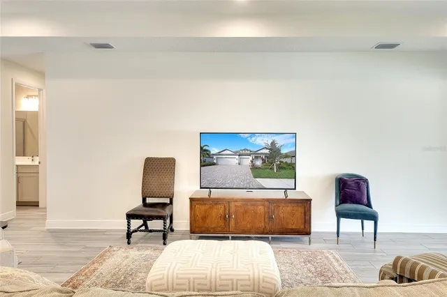a living room with furniture and a rug
