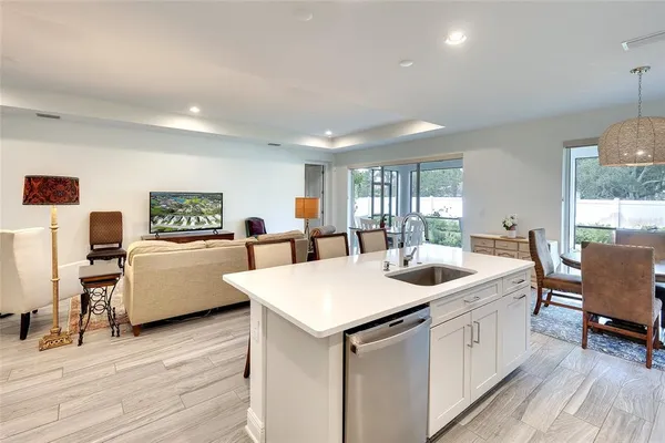 a kitchen with a sink and cabinets