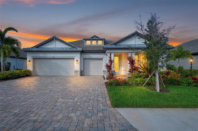 a front view of house with yard and green space