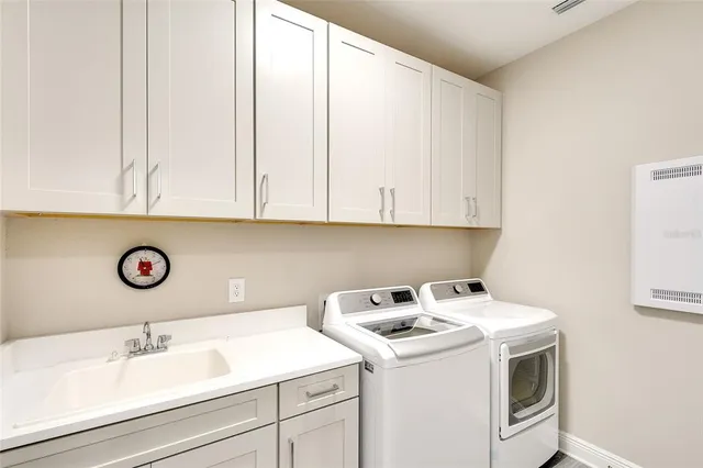 a view of a white house with a yard