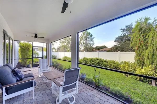 a living room with couch and garden view