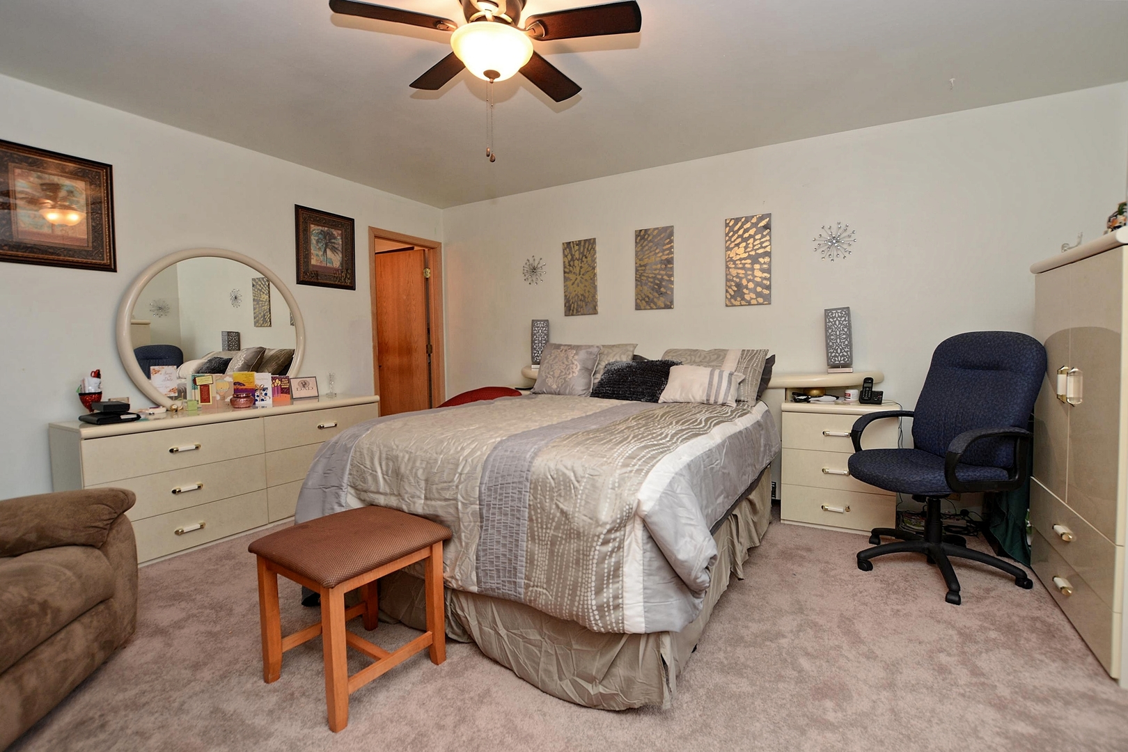 500 Farmview Road University Park, IL 60484 - Photo 22 of 27 a bedroom with a bed a desk and chair with a mirror