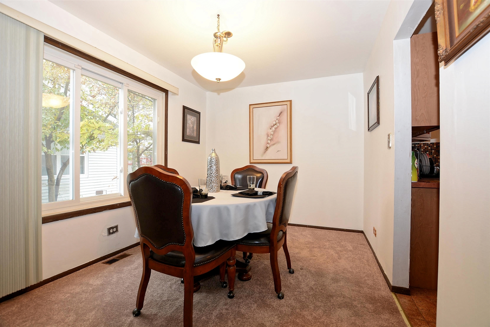 500 Farmview Road University Park, IL 60484 - Photo 7 of 27 a view of a dining room with furniture window and wooden floor