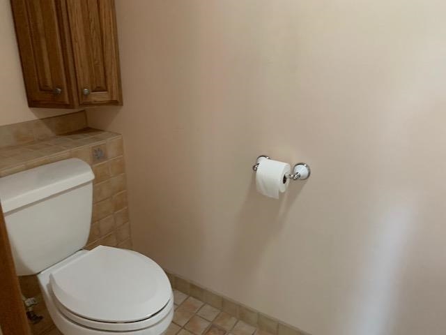 12002 Jackson River Road Monterey, VA 24465 - Photo 16 of 38 a white toilet sitting next to a shower