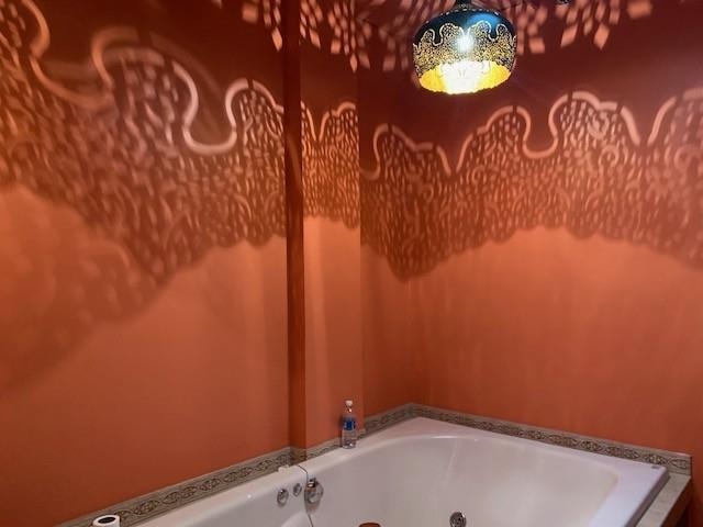 12002 Jackson River Road Monterey, VA 24465 - Photo 29 of 65 a bathroom with a shower curtain and a sink