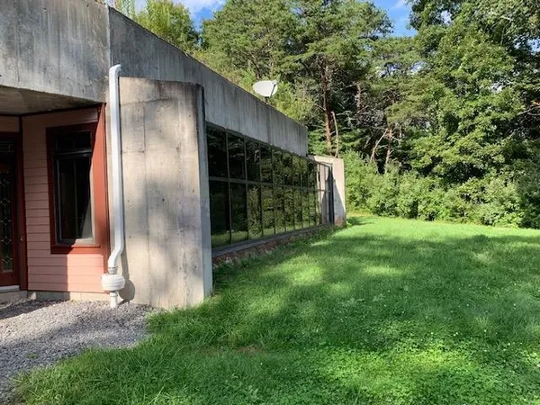 a backyard of a house with lots of green space