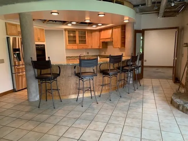 a dinning table and chairs in a room
