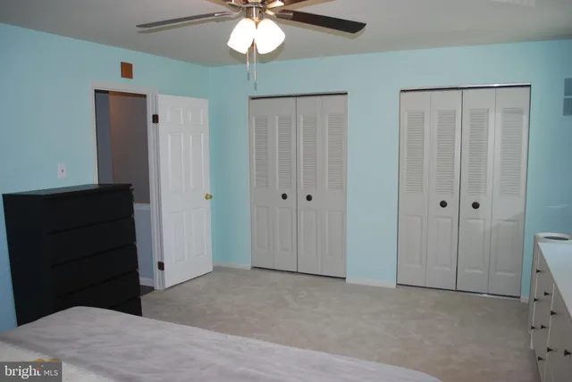 a bathroom with a sink toilet and mirror
