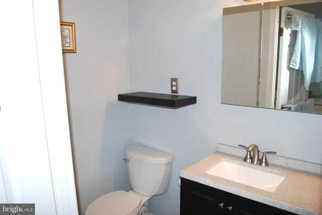 a bathroom with a shower and a sink