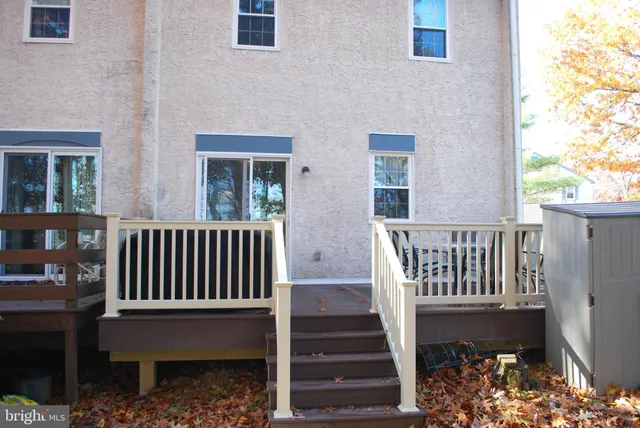 a view of a chairs and table on the balcony