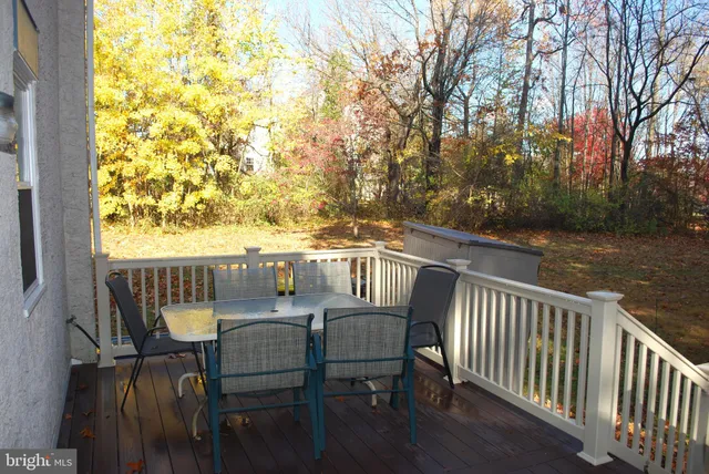 a view of balcony with furniture and wooden deck