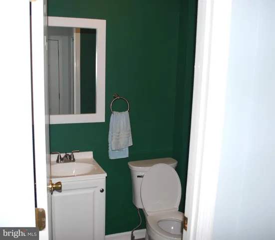 a bathroom with a toilet and a sink