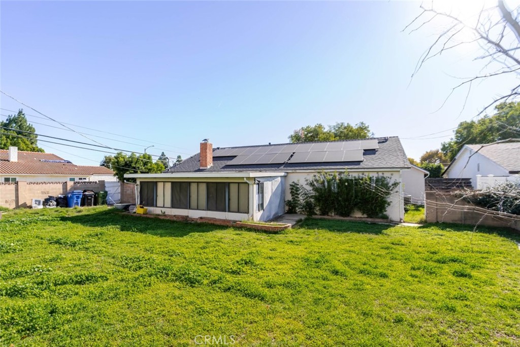 18301 Minnehaha Street Porter Ranch, CA 91326 - Photo 29 of 32 a view of a house with a yard porch and sitting area