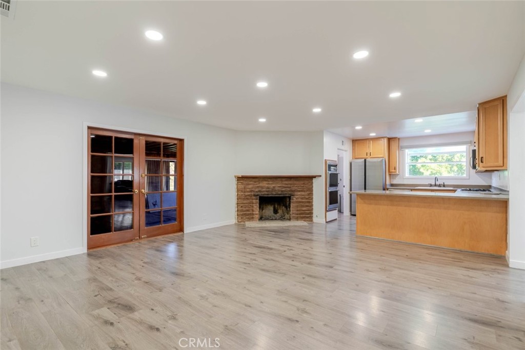 18301 Minnehaha Street Porter Ranch, CA 91326 - Photo 9 of 32 a view of an empty room with a kitchen and a window