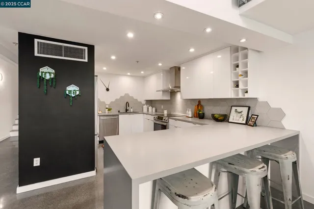 a kitchen with a table and chairs