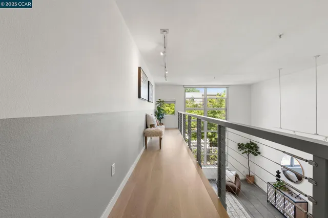 a view of a balcony with wooden floor