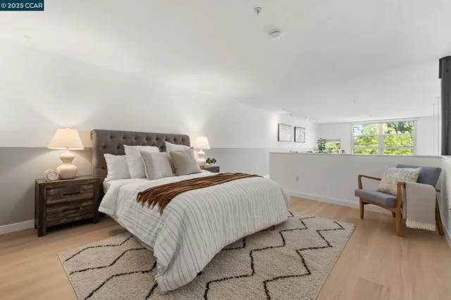 a bedroom with a bed and a chair