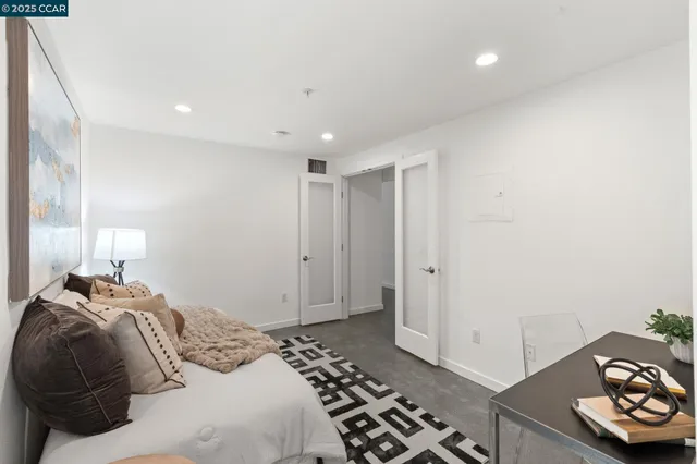 a bedroom with a bed and a dresser