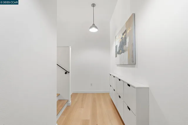 a view of a hallway with washer and dryer