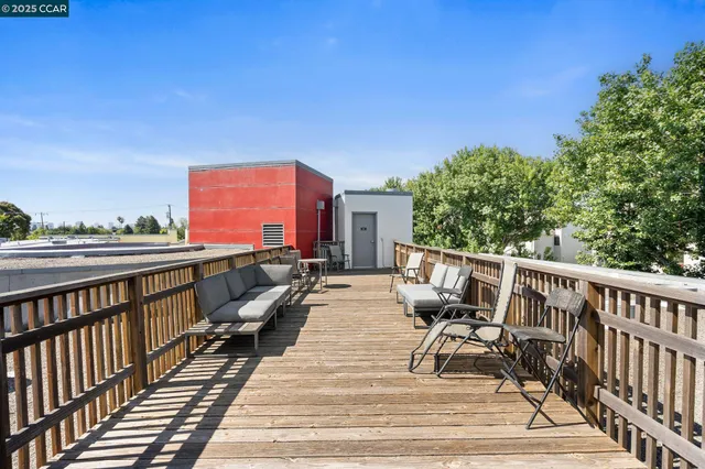 a view of a deck with couches table and chairs