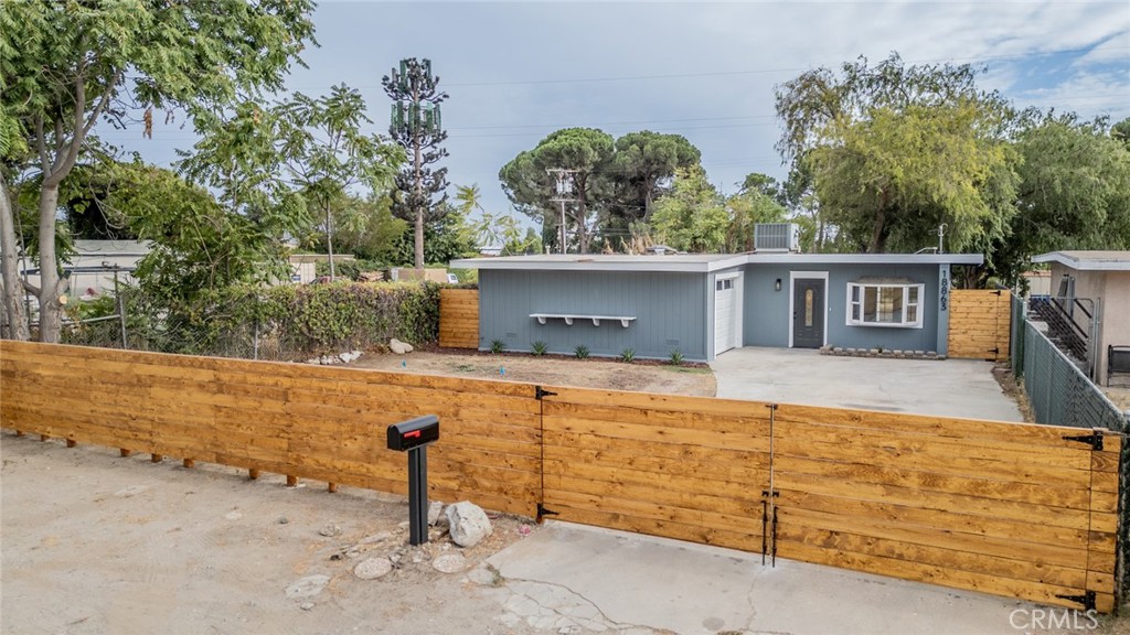 18863 8th Street Bloomington, CA 92316 - Photo 1 of 23 front view of a house with a yard
