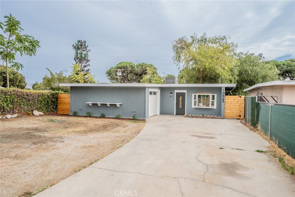 18863 8th Street Bloomington, CA 92316 - Photo 13 of 23 front view of a house with a outdoor space