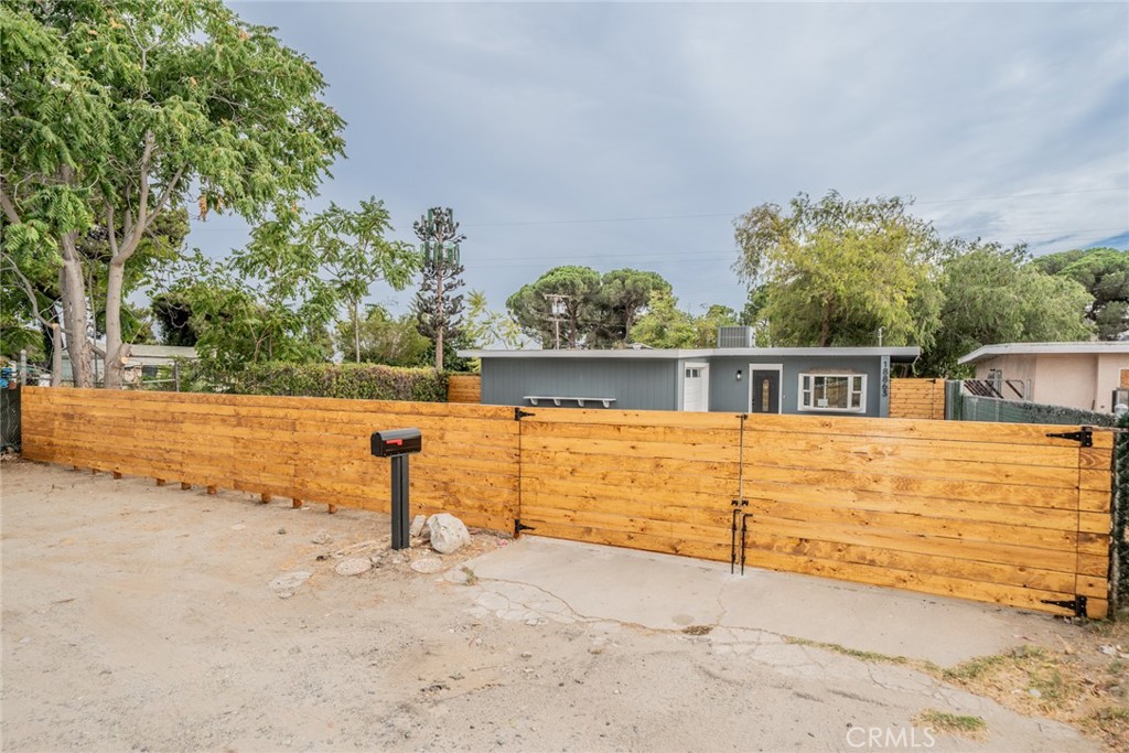 18863 8th Street Bloomington, CA 92316 - Photo 19 of 23 a view of front of house with large trees