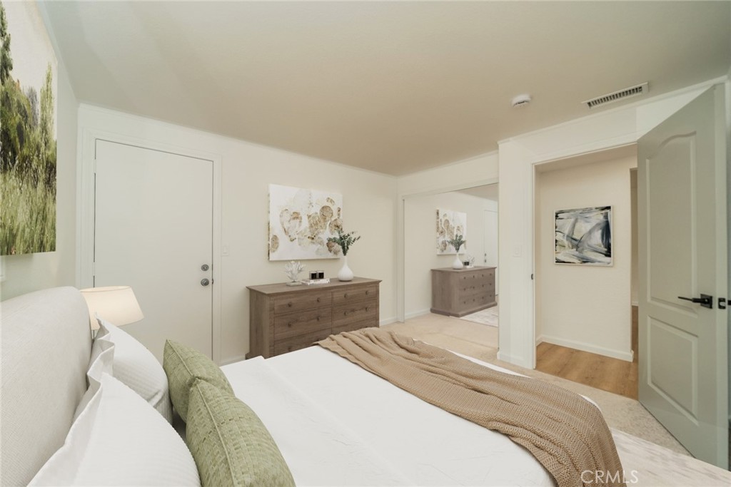 18863 8th Street Bloomington, CA 92316 - Photo 8 of 23 a bedroom with a bed and a couch