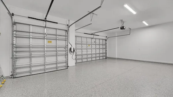 a living room with furniture and large windows