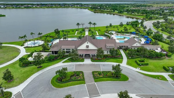 a view of a swimming pool with outdoor seating