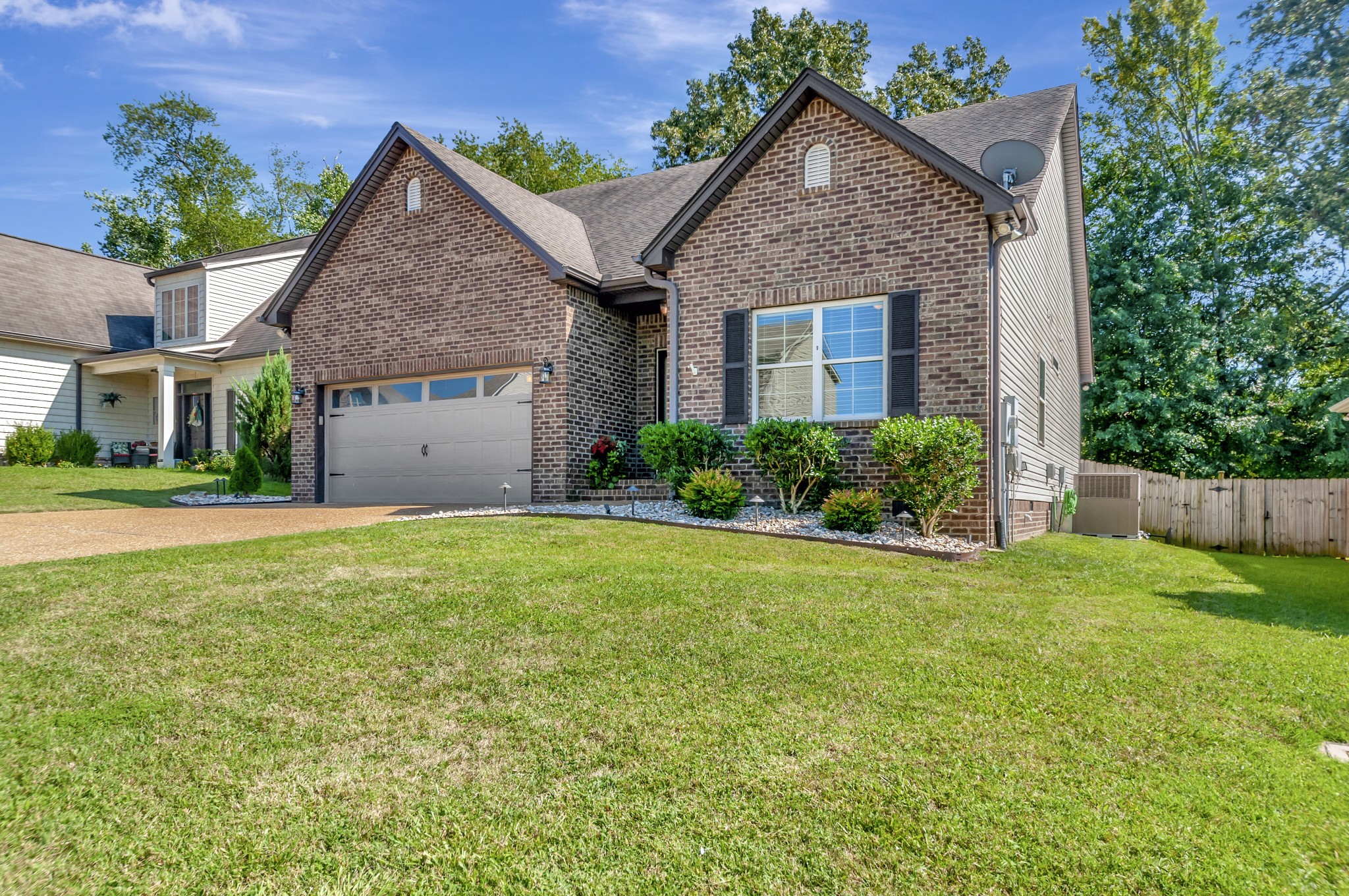 1118 Golf View Way Spring Hill, TN 37174 - Photo 1 of 30 a view of a yard in front of a house with large tree