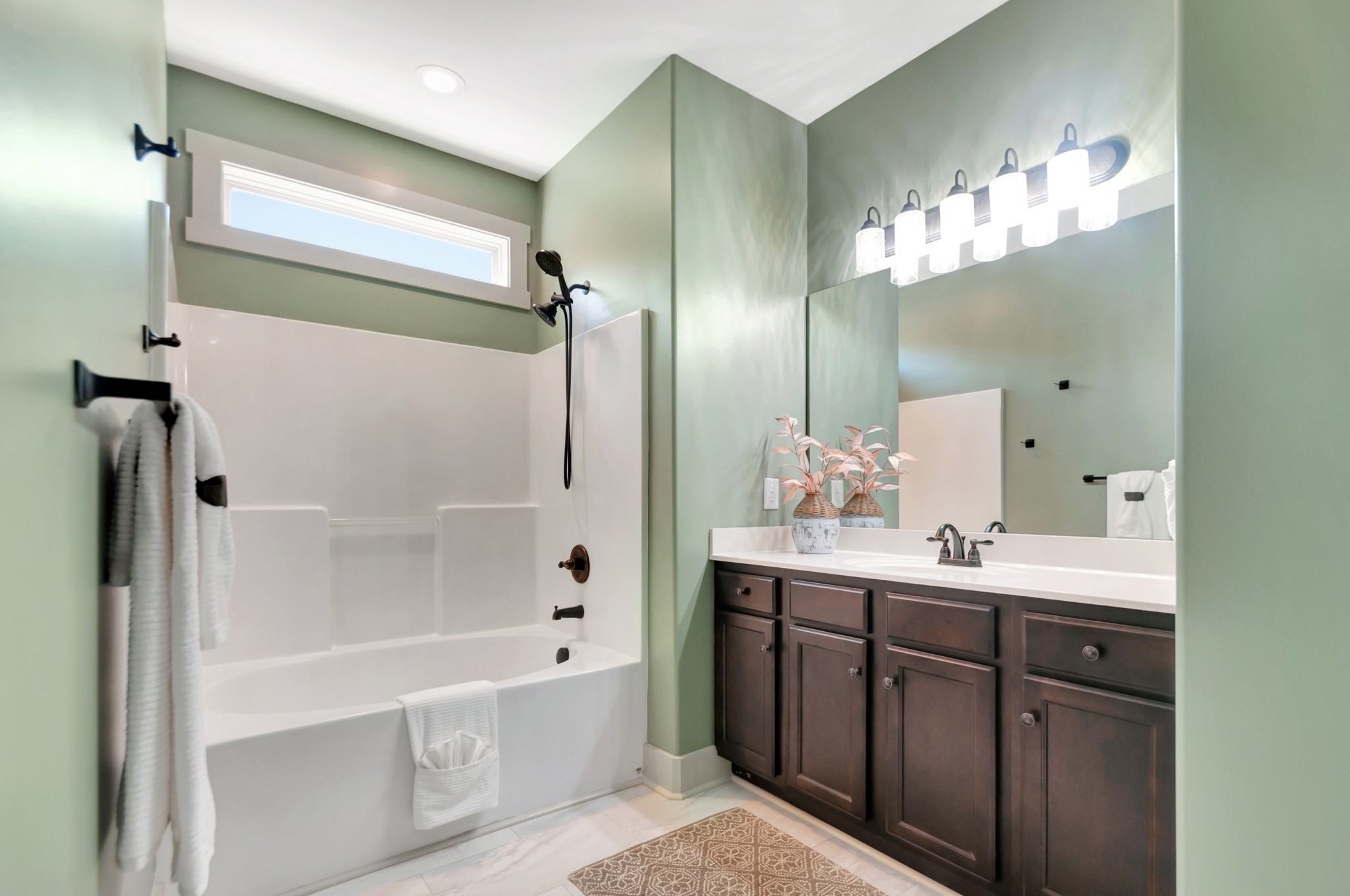 1118 Golf View Way Spring Hill, TN 37174 - Photo 17 of 30 a bathroom with a double vanity sink mirror and shower