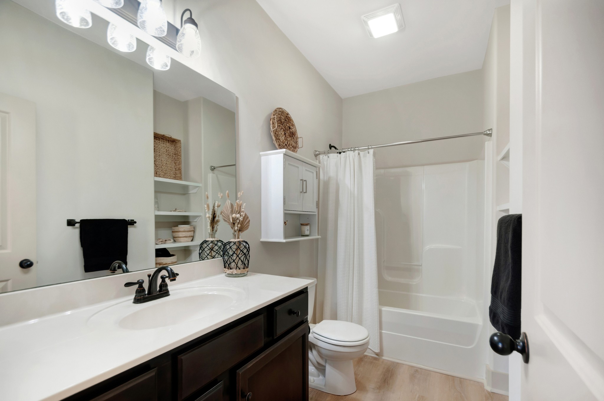 1118 Golf View Way Spring Hill, TN 37174 - Photo 20 of 30 a bathroom with a sink a toilet a mirror and shower